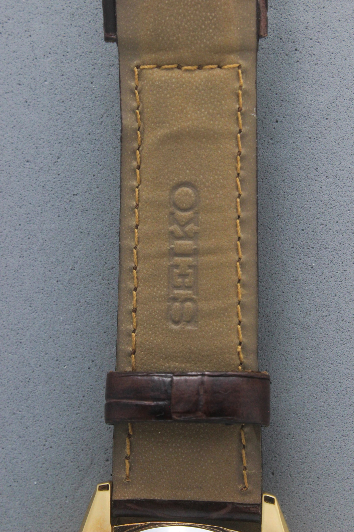 Inner view of the Seiko Caster watch strap, emphasizing the embossed "Seiko" logo on the beige leather lining. The genuine leather strap combines durability and luxury, enhancing the overall design of this vintage timepiece.