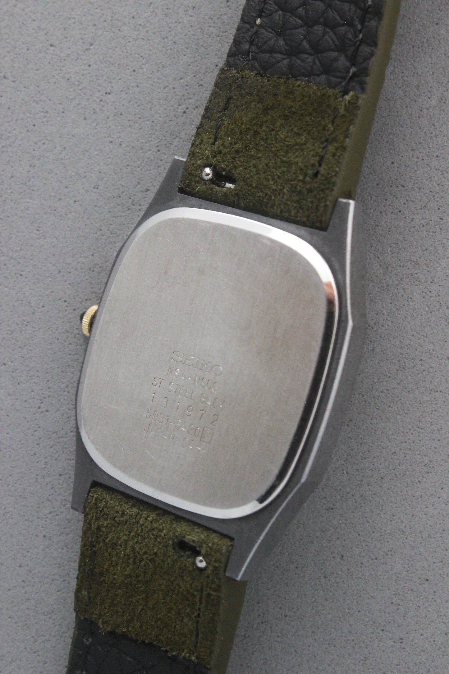 The stainless steel case back of the Seiko Dolce 5931-5420 displays engraved details, including "5931-5420," "NSA*NSCG," and
"Made in Japan." The polished finish emphasizes the watch's premium craftsmanship.
