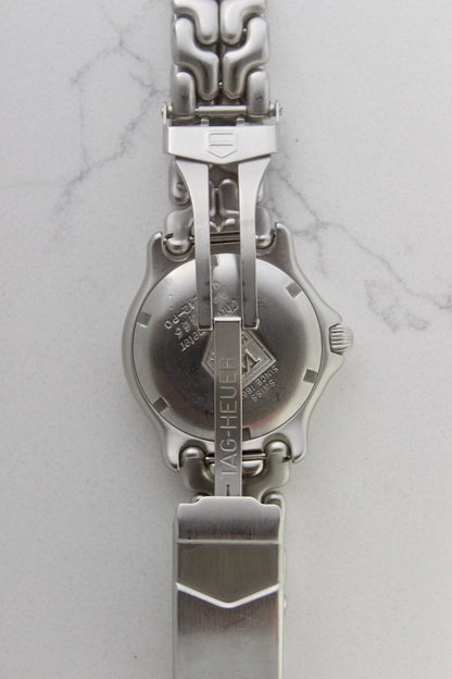 Tag Heuer S/EL Ref. WG5113-P0 stainless steel automatic chronometer watch, 35mm case, 8.6mm thick. Features a two-level dial, TAG Heuer logo, numerals at 6 & 9 o’clock, and a date window. Rotating steel diver bezel, original 6.9" bracelet, and 21-jewel self-winding movement. Includes dive bezel, hours, minutes, seconds & date functions. Rare configuration in great condition with minimal wear. 
