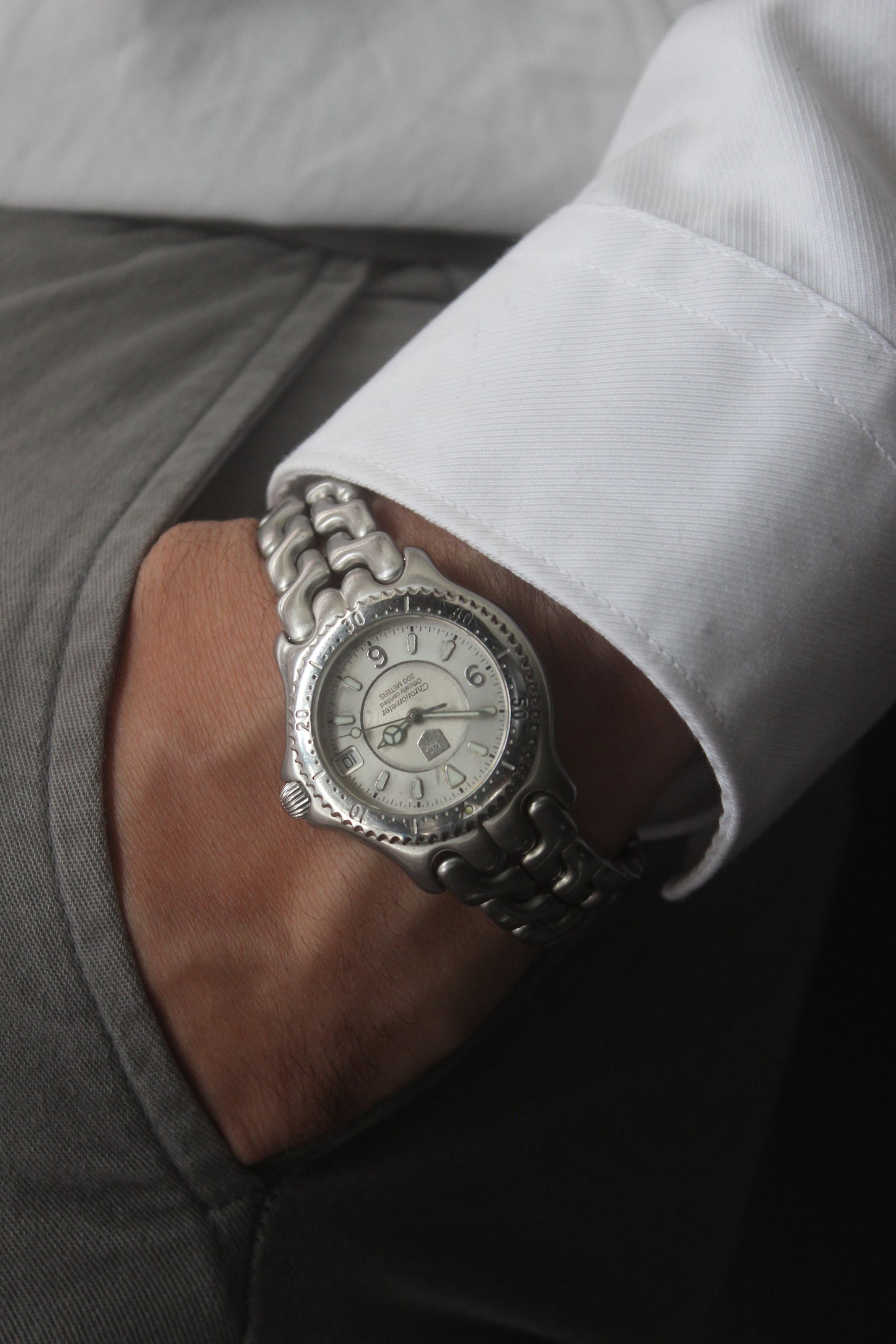 Tag Heuer S/EL Ref. WG5113-P0 stainless steel automatic chronometer watch, 35mm case, 8.6mm thick. Features a two-level dial, TAG Heuer logo, numerals at 6 & 9 o’clock, and a date window. Rotating steel diver bezel, original 6.9" bracelet, and 21-jewel self-winding movement. Includes dive bezel, hours, minutes, seconds & date functions. Rare configuration in great condition with minimal wear. 