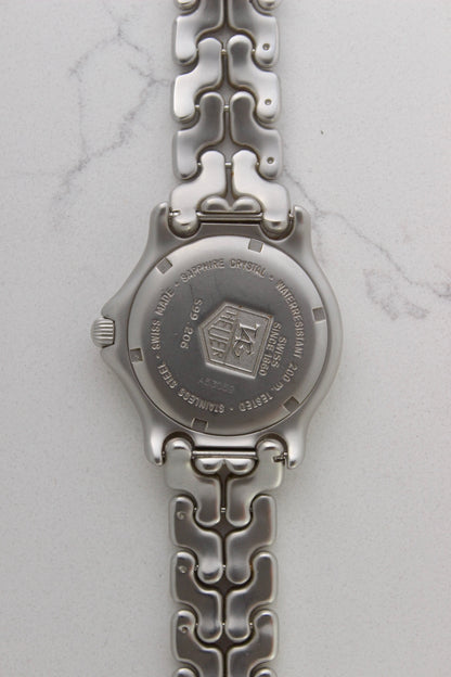 Case back of the Tag Heuer Professional S/EL Ref. S99.206, featuring an engraved Tag Heuer logo, water resistance rating of 200M, and Swiss-made stainless steel construction. Includes sapphire crystal and original bracelet. A rare and collectible vintage timepiece.