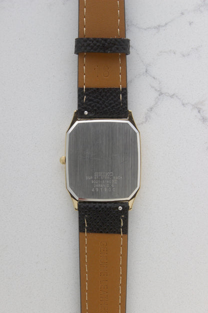 The stainless steel back of the Seiko Chariot 9021-5180 displays the engraved model number, "9021-5180," along with "SGP ST.
Steel Back" and "Made in Japan." The brushed finish highlights its premium quality and craftsmanship.
