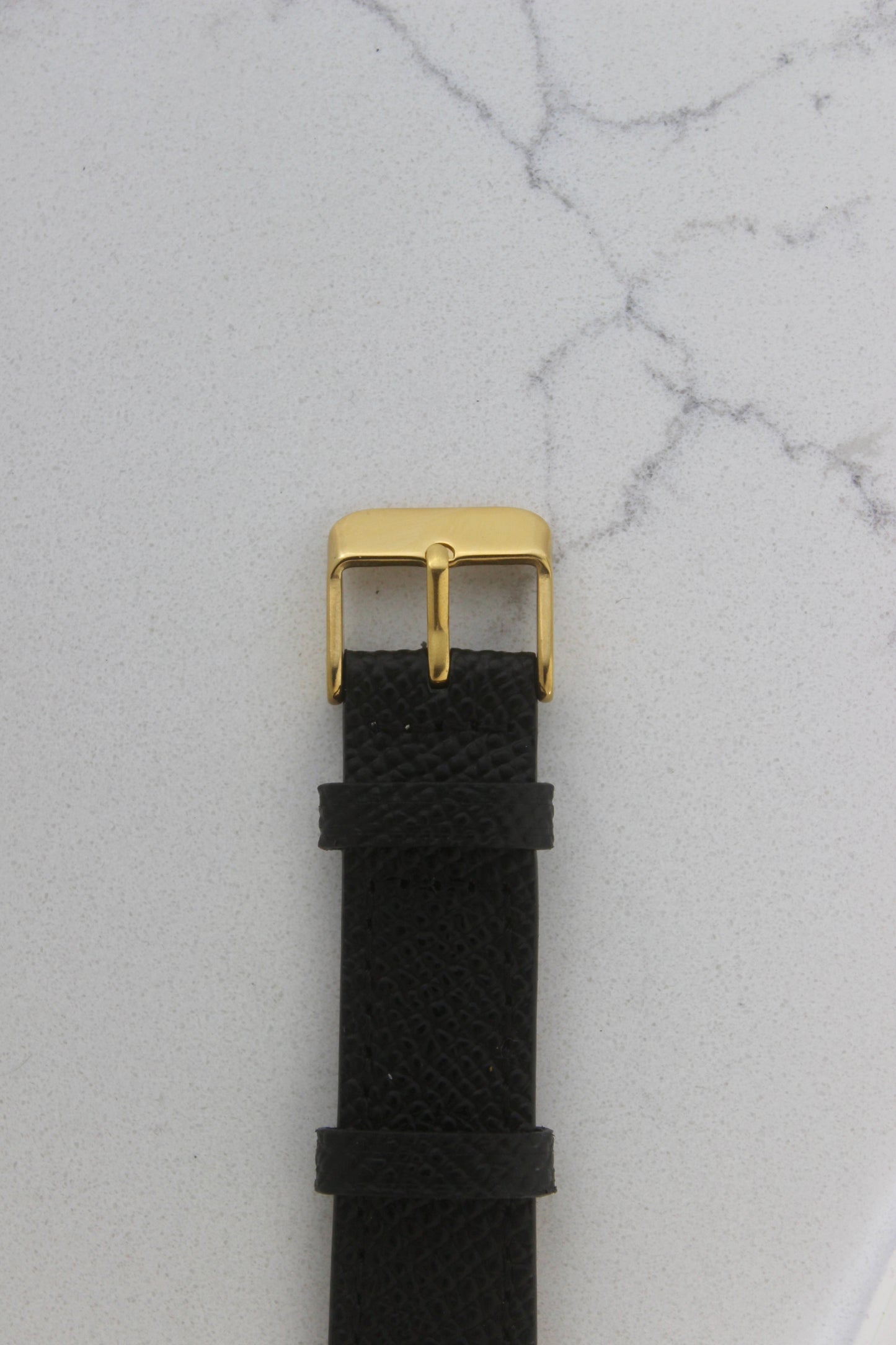 Seiko Chariot 9021-5180 showcasing the black leather strap and gold-plated buckle that complements the luxurious design of this classic timepiece.