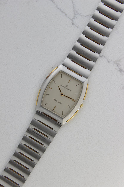 Front View of Universal Genève White Shadow Ref. 617-020
A close-up of the Universal Genève White Shadow Ref. 617-020, featuring a sleek tonneau-shaped stainless steel case with gold accents, a clean white dial, and minimalist stick hands and indices. Paired with an integrated stainless steel bracelet for timeless elegance.